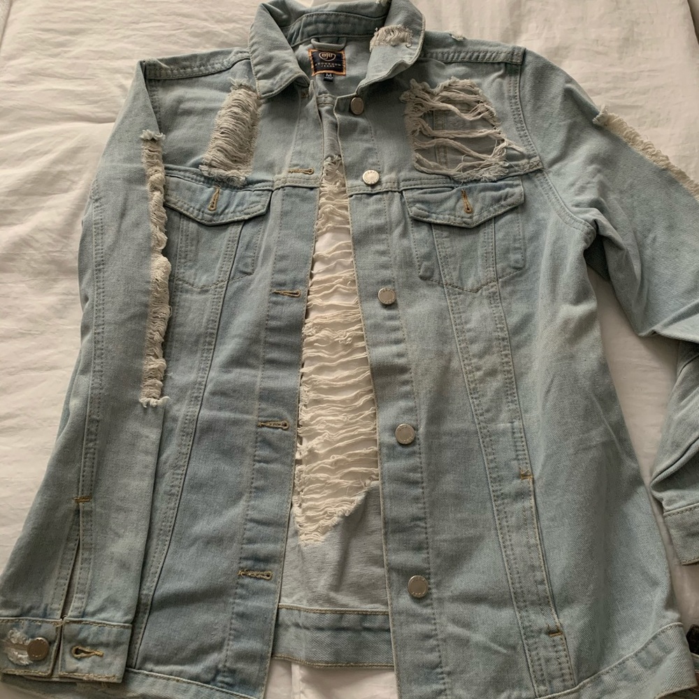 Ripped and distressed denim jacket